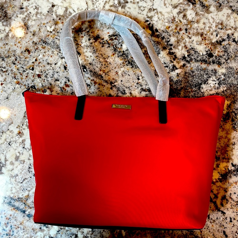 Kate Spade Red Nylon Tote. Brand new. With original packing and straps covered